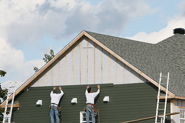 Professional Emergency Siding Repair technician working in Warren, OH